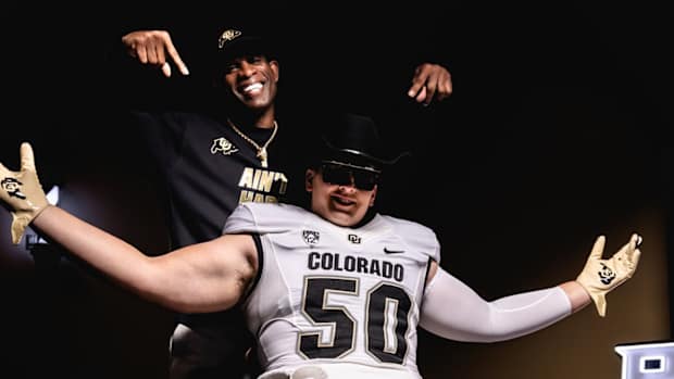 Colorado Buffaloes Talan Chandler poses with Deion Sanders